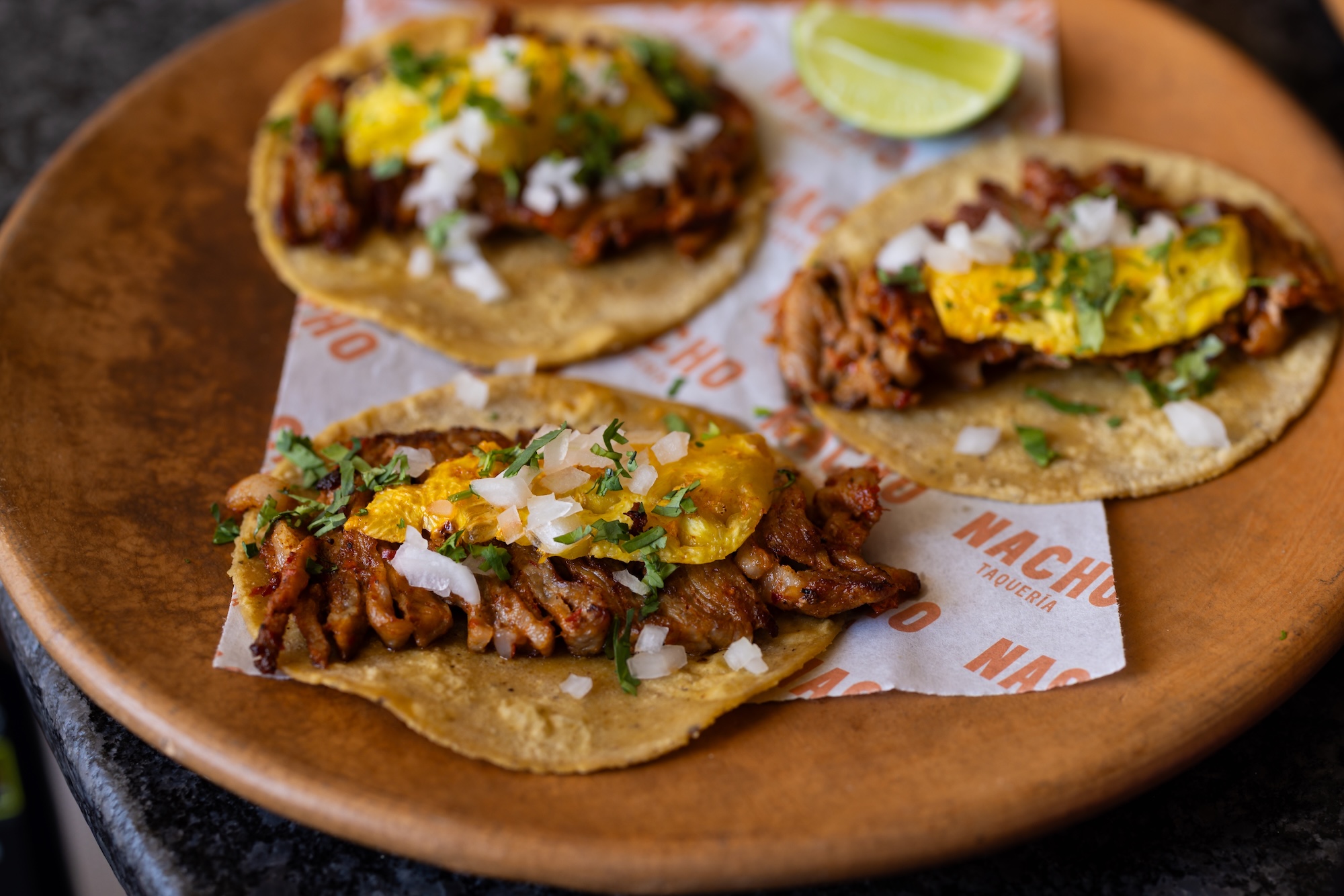 Tacos al pastor with charred pineapple at Nacho Tacos al pastor with charred pineapple at Nacho
